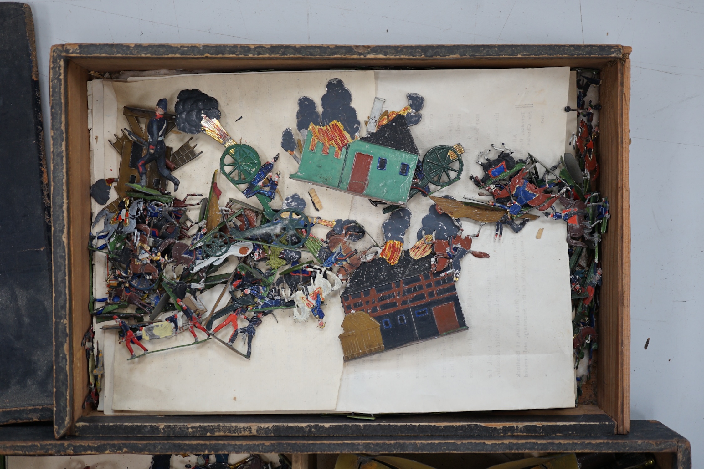 Two late nineteenth century wooden Haffner boxes of flat/semi-flat soldiers, contents believed to be primarily by Haffner; ‘Fight of Paris’ (set no.543) and ‘Battle of Sedan’ (set no.528)